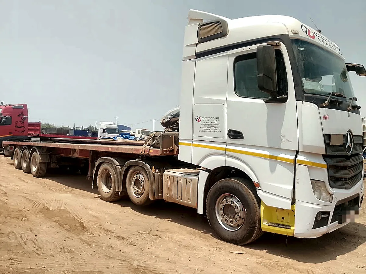 Octane Transport Mercedes-Benz Actros prime mover coupled to a tri-axle flatbed trailer